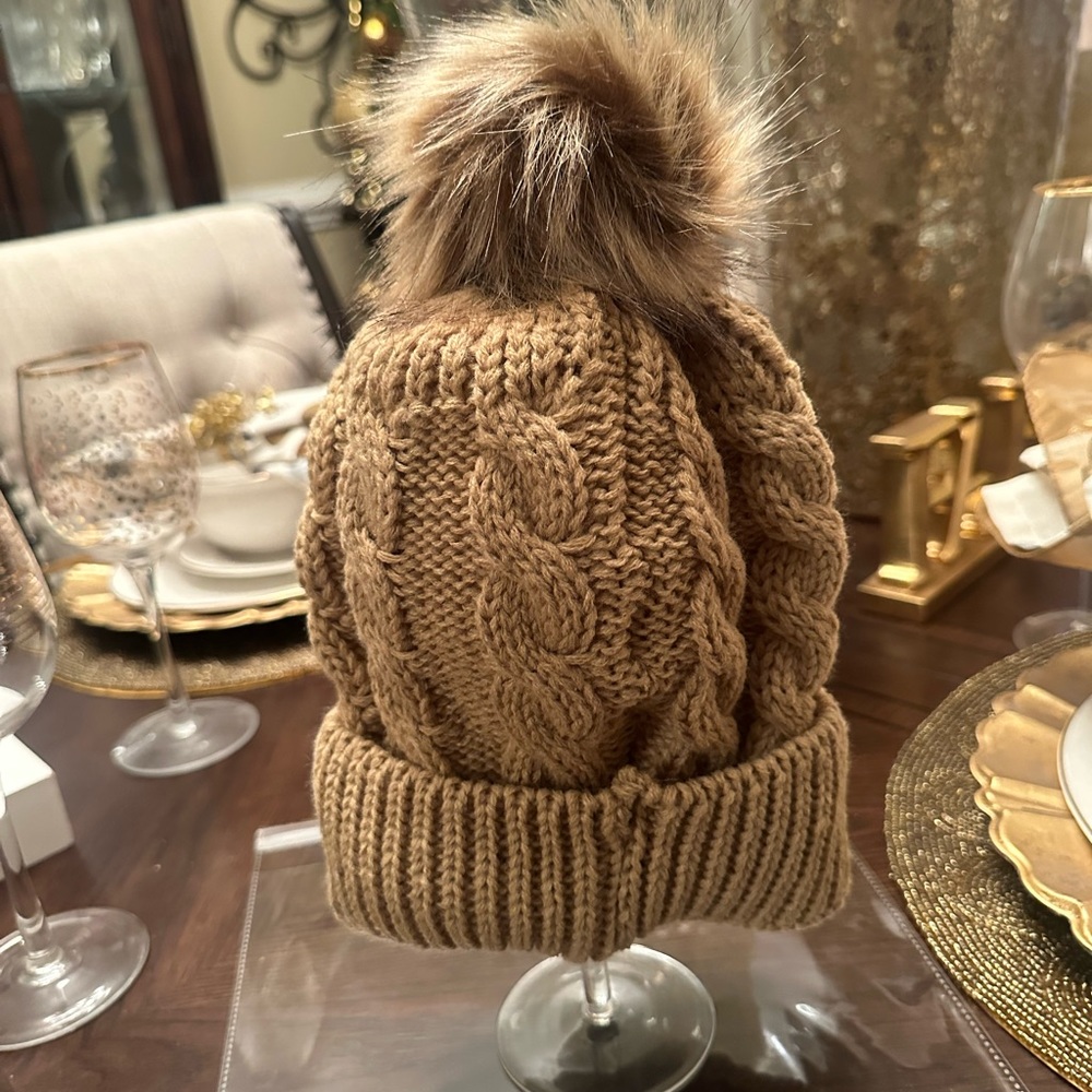 New in packaging. Women Tan Awesome Puff Beanie just in time 4 the cold weather.